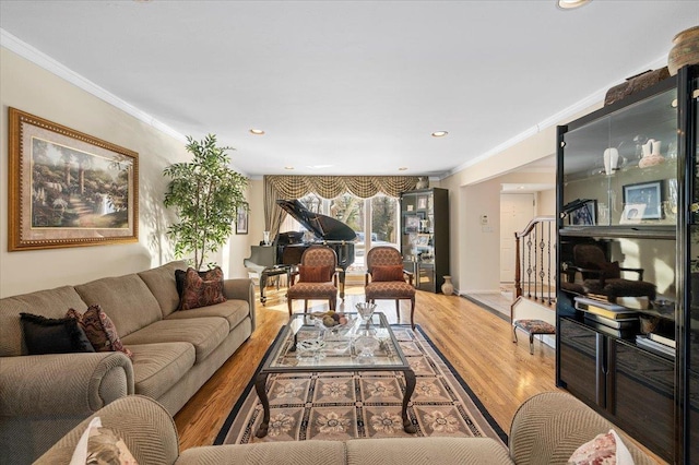 living room featuring ornamental molding and wood-type flooring