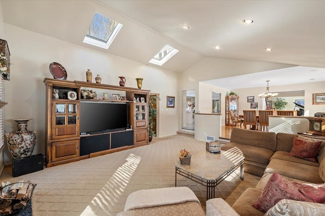 living room with lofted ceiling, a notable chandelier, and light carpet