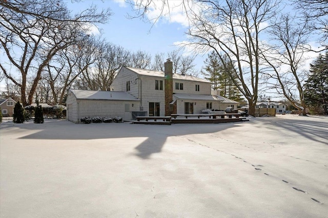 back of house featuring a deck