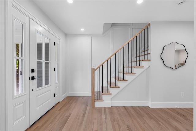 entrance foyer with light hardwood / wood-style flooring