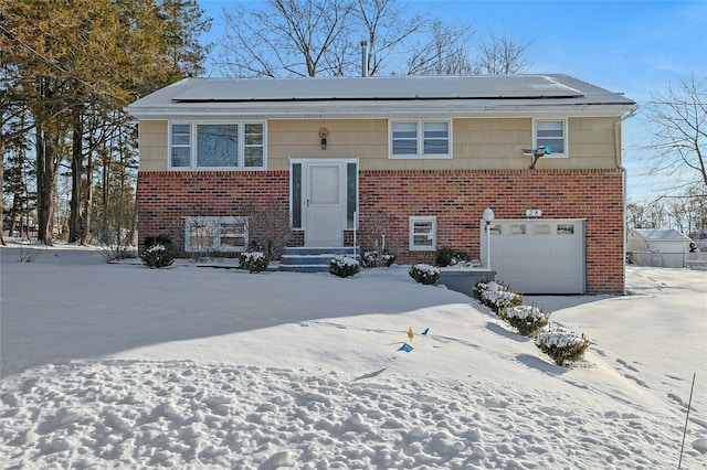 bi-level home featuring a garage