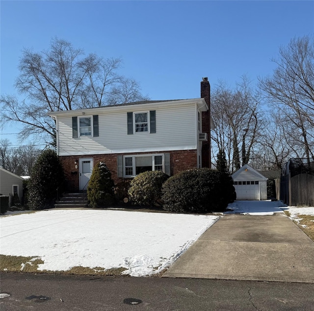 view of front property featuring a garage and an outdoor structure