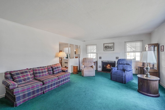 carpeted living room with a brick fireplace and a textured ceiling