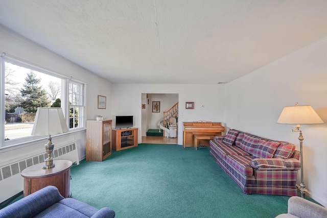 carpeted living room featuring radiator heating unit