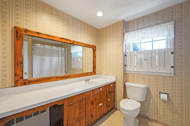 bathroom featuring vanity, radiator heating unit, toilet, and a shower with shower curtain