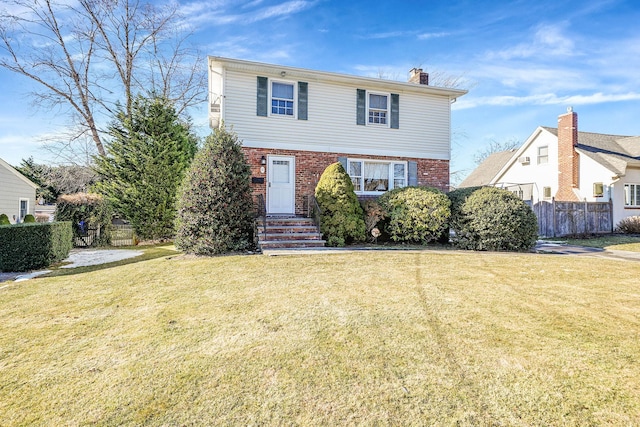 front facade with a front yard