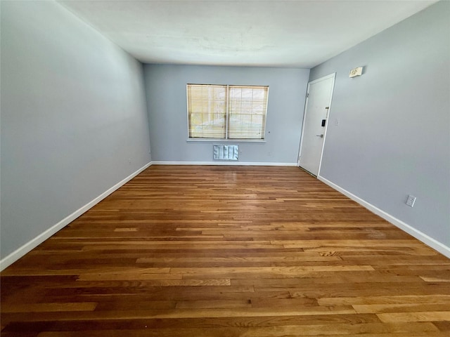 unfurnished room featuring hardwood / wood-style floors