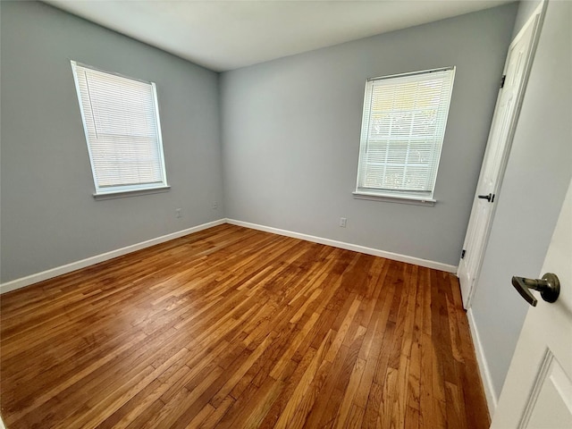 empty room featuring hardwood / wood-style floors