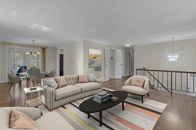 living room with a chandelier and wood-type flooring