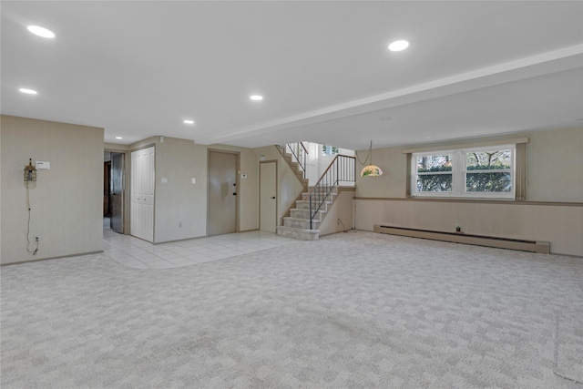 basement with light carpet and a baseboard radiator