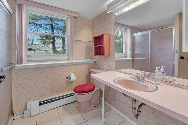 bathroom featuring sink, walk in shower, toilet, a baseboard radiator, and tile patterned floors