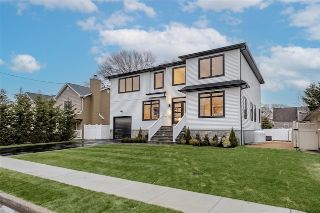 view of front of home with a front lawn