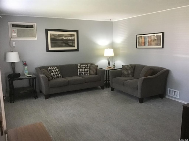 living room featuring an AC wall unit and carpet floors