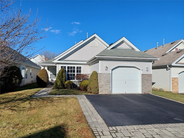 view of front facade with a garage and a front yard