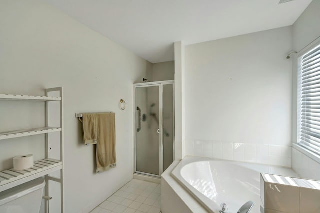 bathroom featuring separate shower and tub and tile patterned flooring