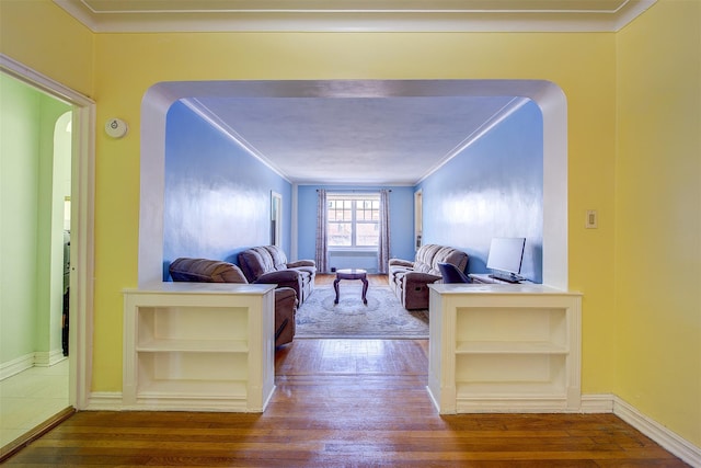 living room featuring hardwood / wood-style floors and ornamental molding