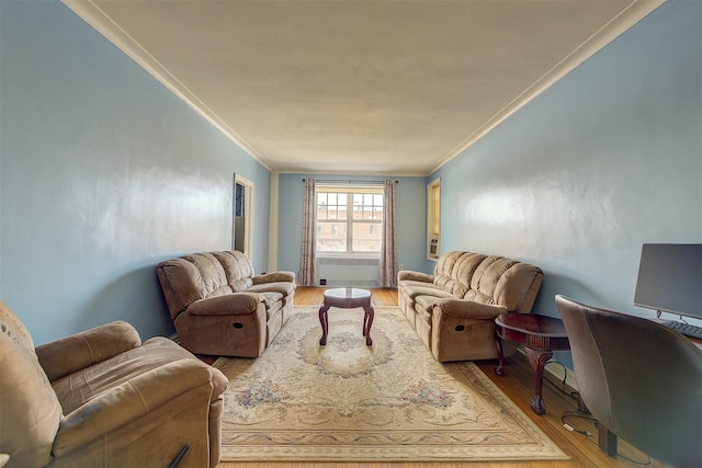 living room featuring light hardwood / wood-style flooring and ornamental molding