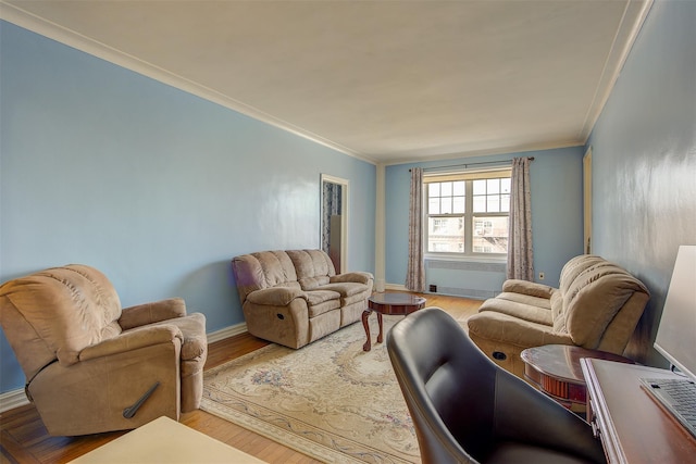 living room with light hardwood / wood-style flooring and ornamental molding