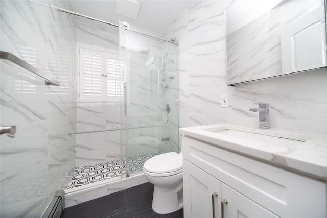 bathroom with a shower with shower door, tile patterned flooring, vanity, a baseboard heating unit, and toilet