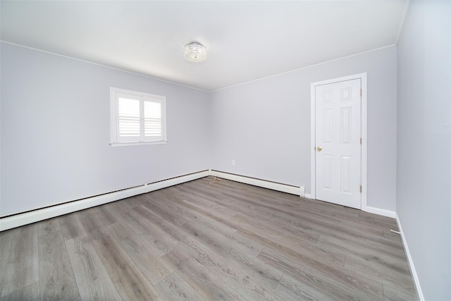 empty room with light hardwood / wood-style floors