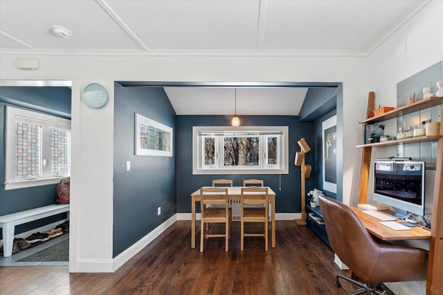 dining space with crown molding and dark wood-type flooring