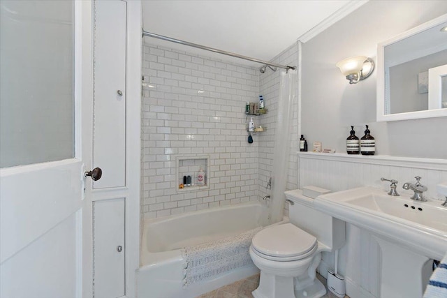 full bathroom with ornamental molding, toilet, shower / tub combo, and sink