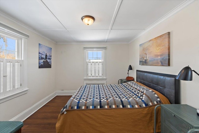 bedroom with crown molding and dark wood-type flooring