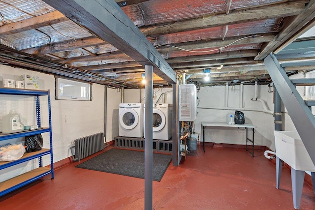 basement featuring independent washer and dryer and water heater