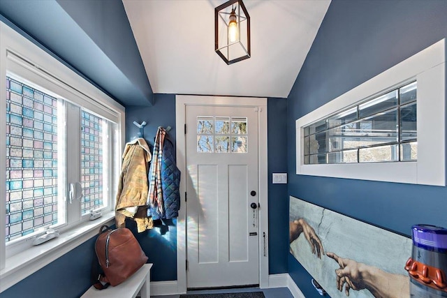 entryway featuring vaulted ceiling