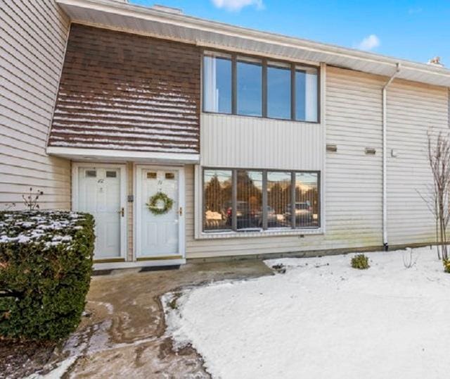 view of snow covered house