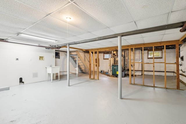 basement featuring a paneled ceiling