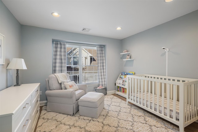 bedroom featuring a crib