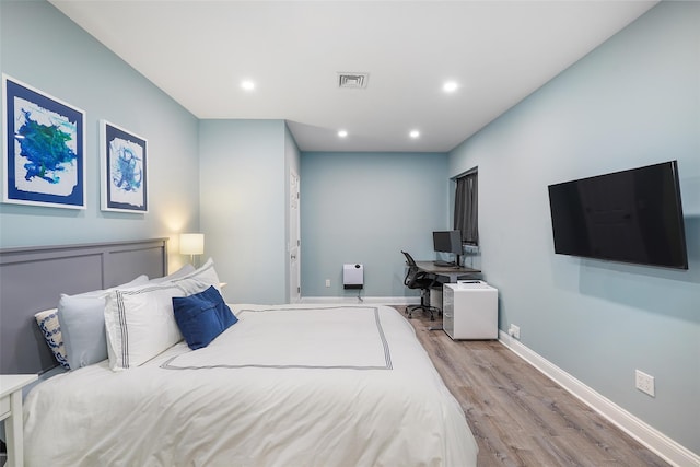 bedroom with light wood-type flooring