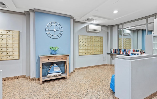 interior space with a wall mounted AC and a mail area