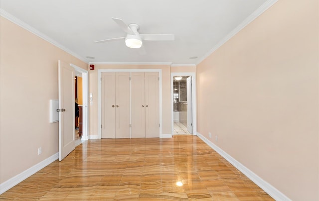 unfurnished bedroom with ceiling fan, ornamental molding, ensuite bathroom, and a closet