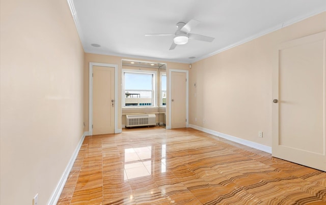 empty room with crown molding and ceiling fan