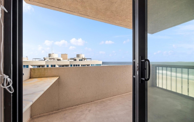 balcony featuring a water view