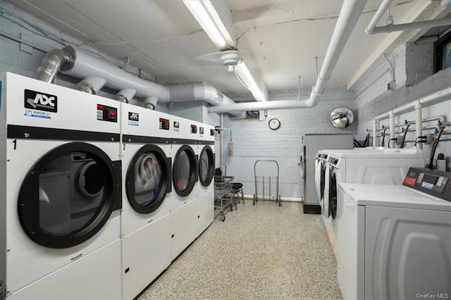 washroom featuring washing machine and clothes dryer