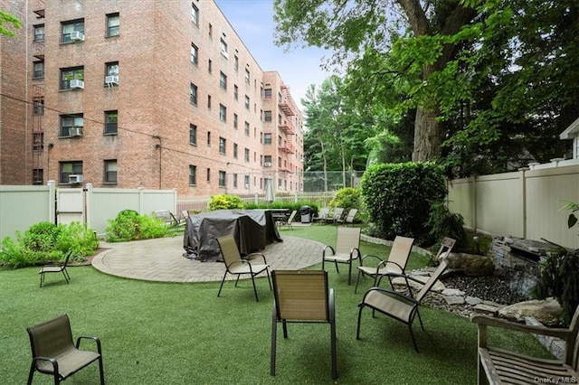 surrounding community featuring a patio area and a yard