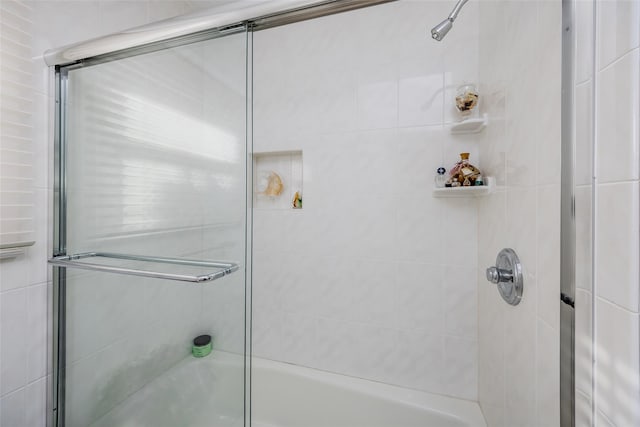 full bathroom with shower / bath combination with glass door