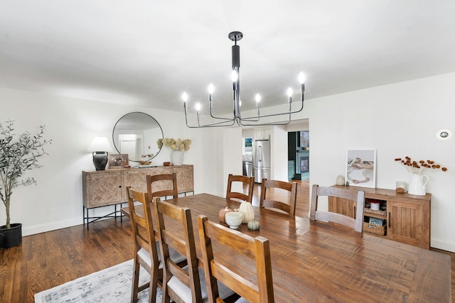 dining room with dark hardwood / wood-style flooring