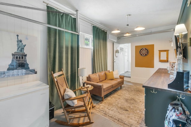 interior space featuring a wall mounted air conditioner, concrete flooring, and wood walls