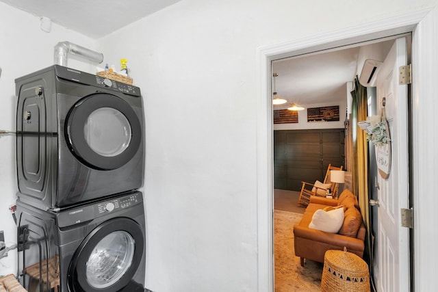 washroom featuring stacked washer and clothes dryer