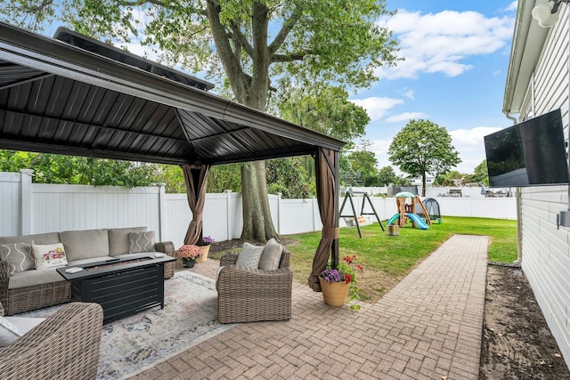 view of patio / terrace with an outdoor living space and a playground