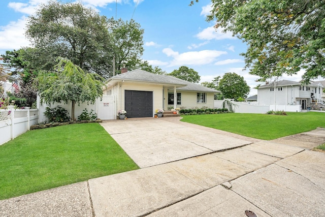 view of front facade with a garage and a front yard