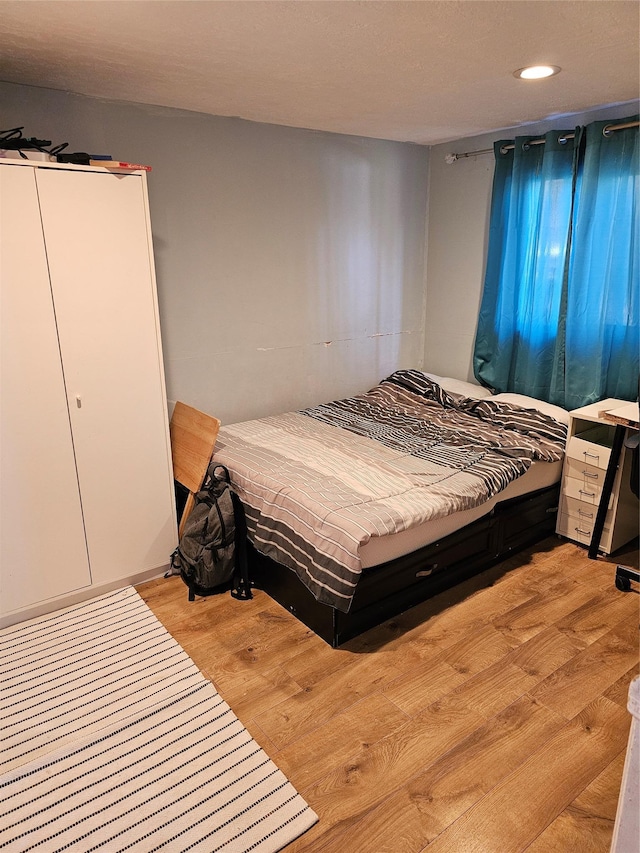 bedroom featuring light hardwood / wood-style floors