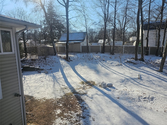 view of yard covered in snow