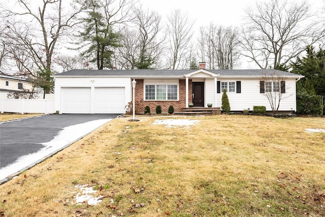 view of front facade with a garage and a front yard