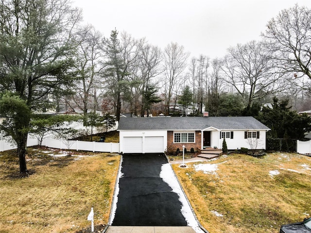 view of front facade with a garage and a front yard