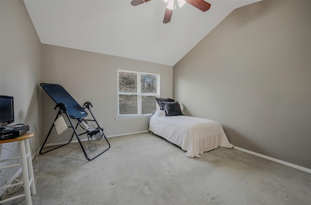 bedroom featuring vaulted ceiling, light colored carpet, and ceiling fan